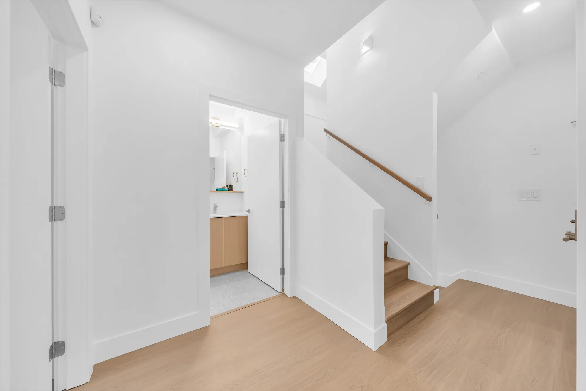 The upstairs hall: the stair up to the loft, doors to the bedrooms and the bathroom