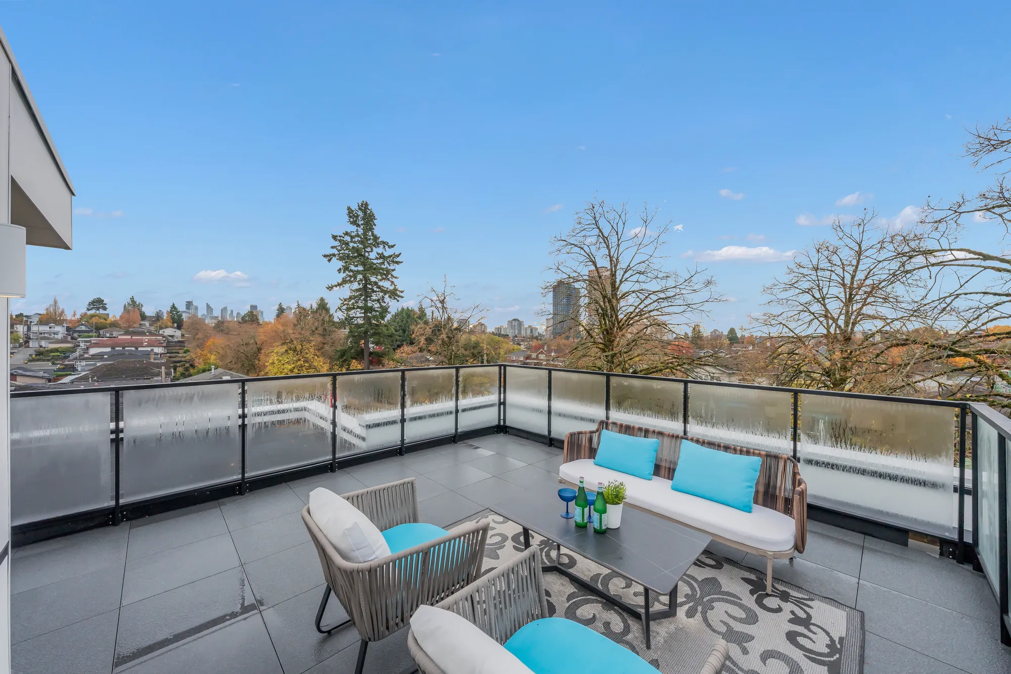 The roof terrace from the other corner: the seating and the treetops